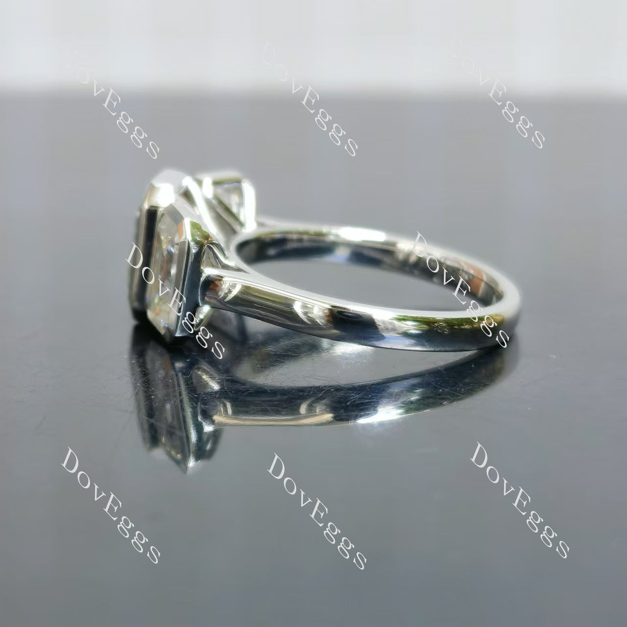 Doveggs emerald/elongated emerald bezel three stones moissanite engagement ring