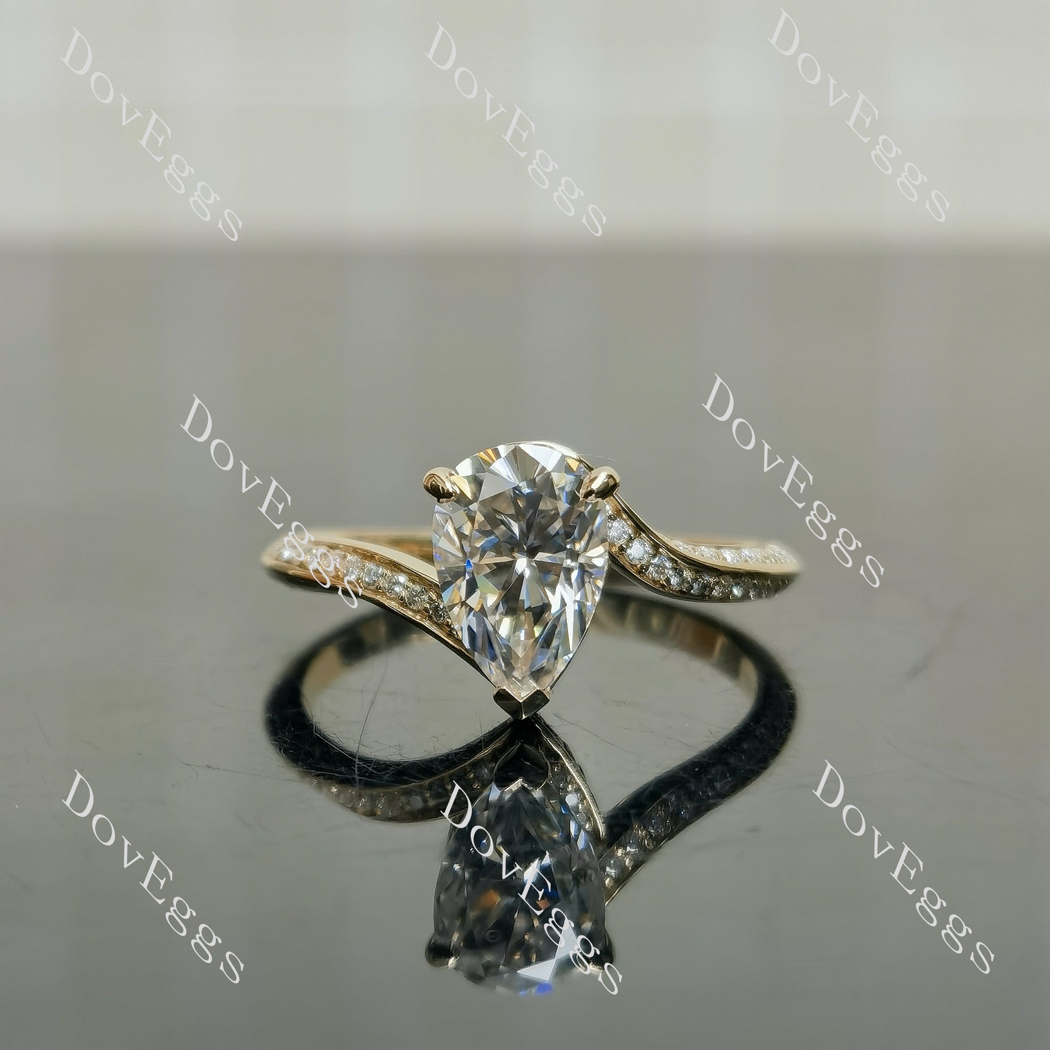 Stephanie’s Promise pear pave channel moissanite engagement ring