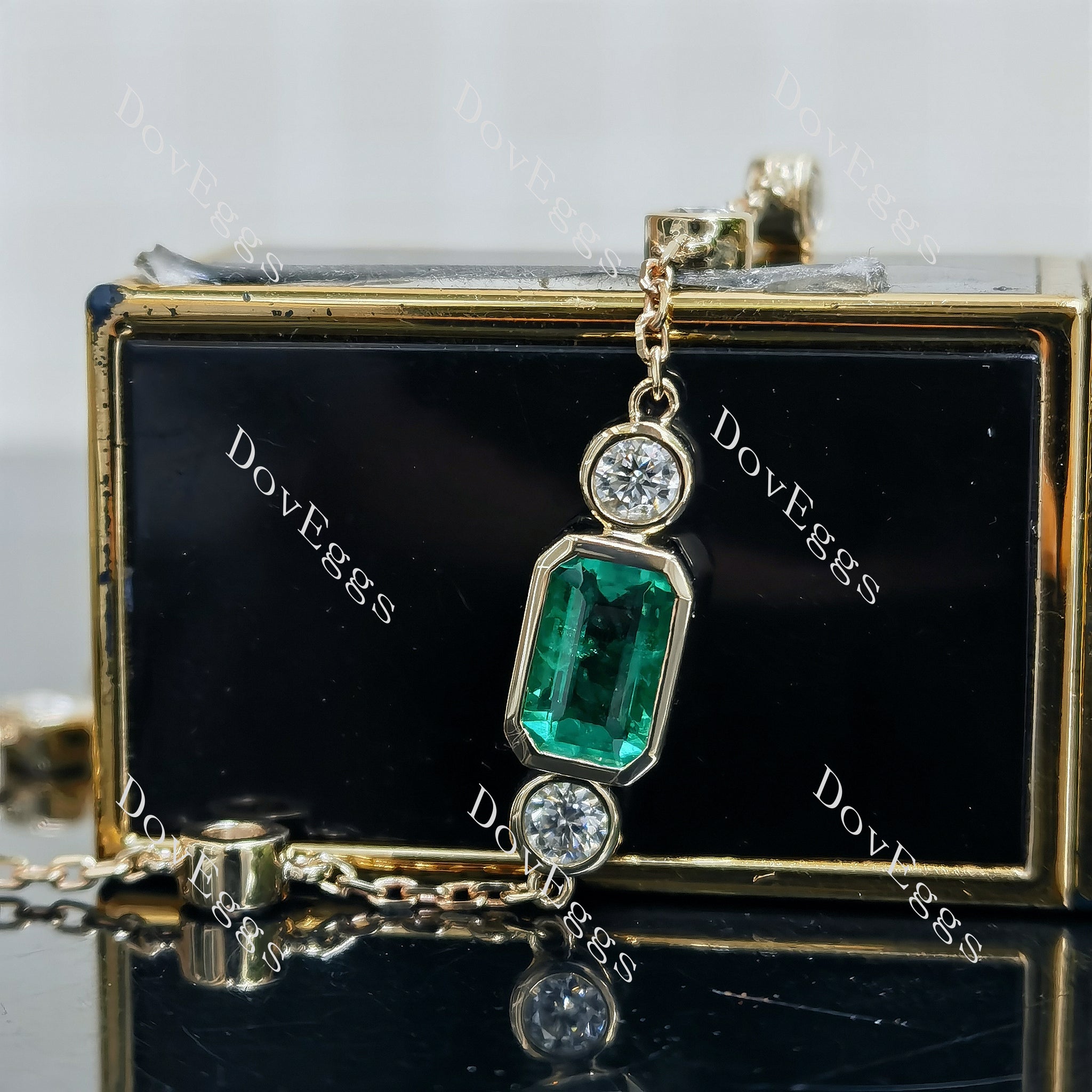 Doveggs elongated emerald colored gem/moissanite bracelet