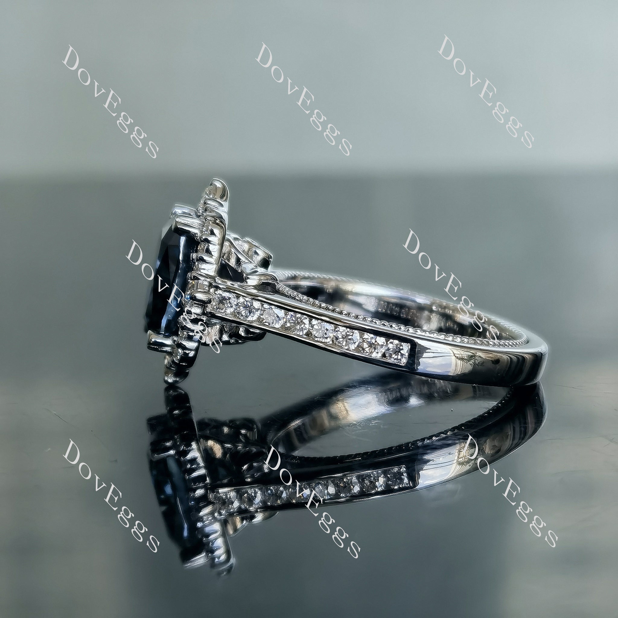 The Crystal cushion halo twilight blue moissanite engagement ring