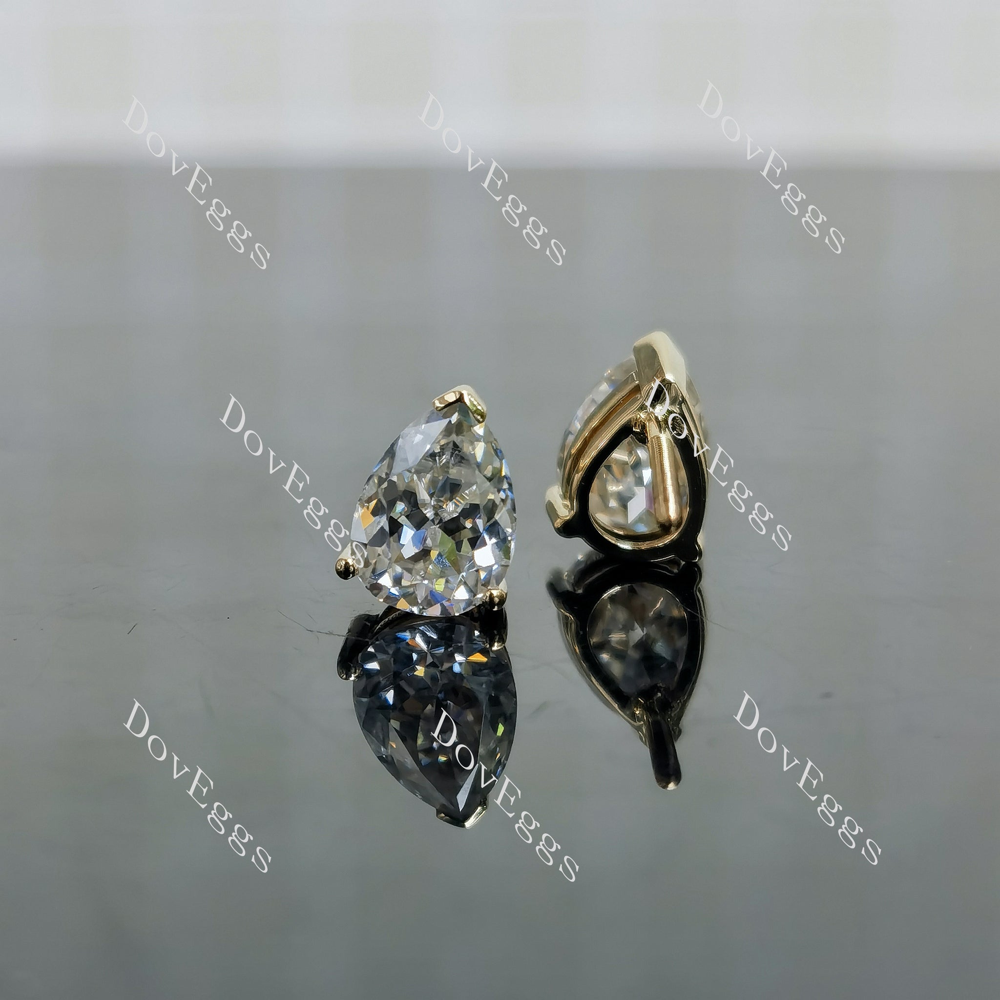 Doveggs pear pave moissanite earrings