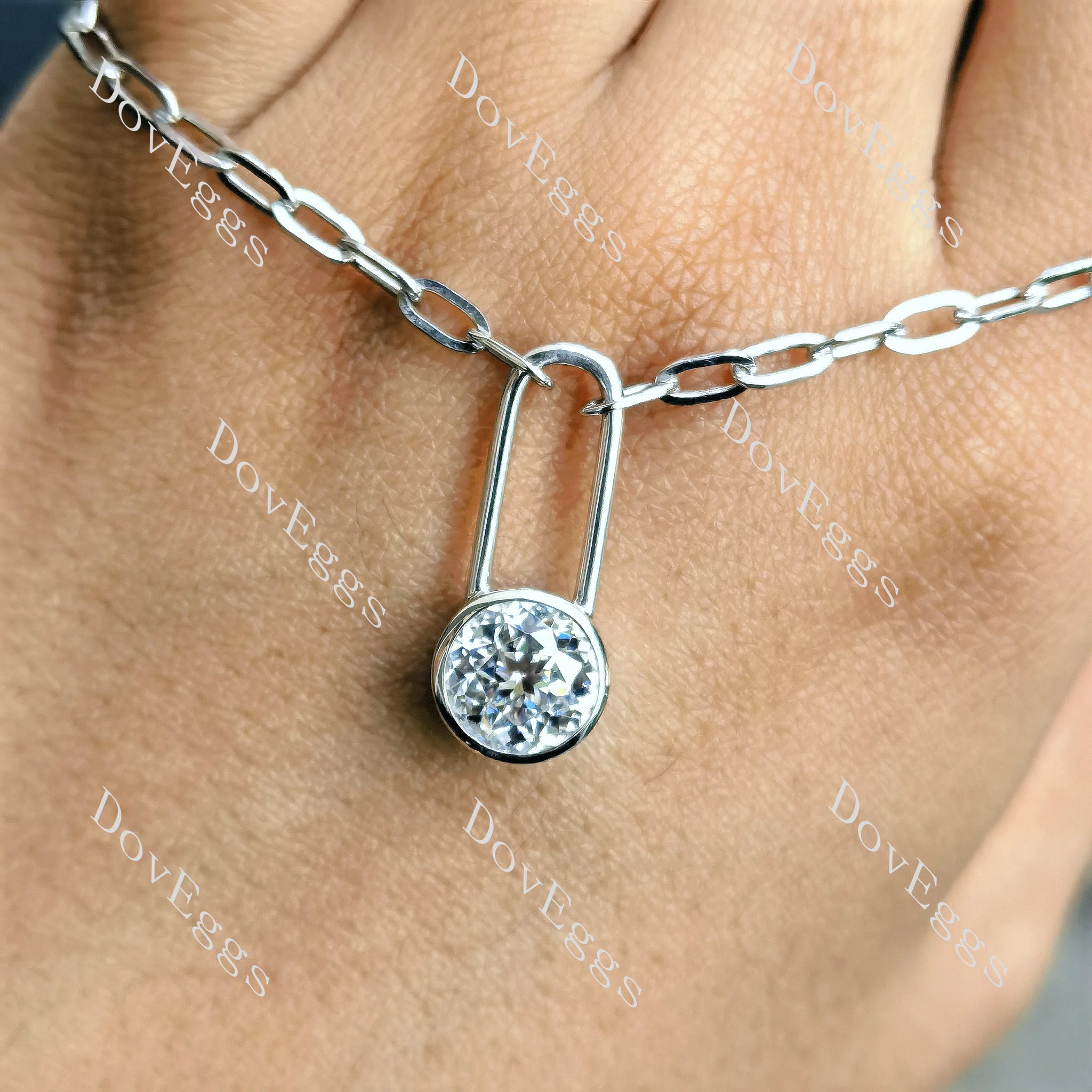 Round bezel solitaire moissnaite pendant necklace with chain on hand  view| Doveggs