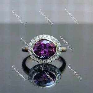 Oval purple colored gemstone with rich color and brilliant fire, surrounded by pave moissanite stones|Doveggs