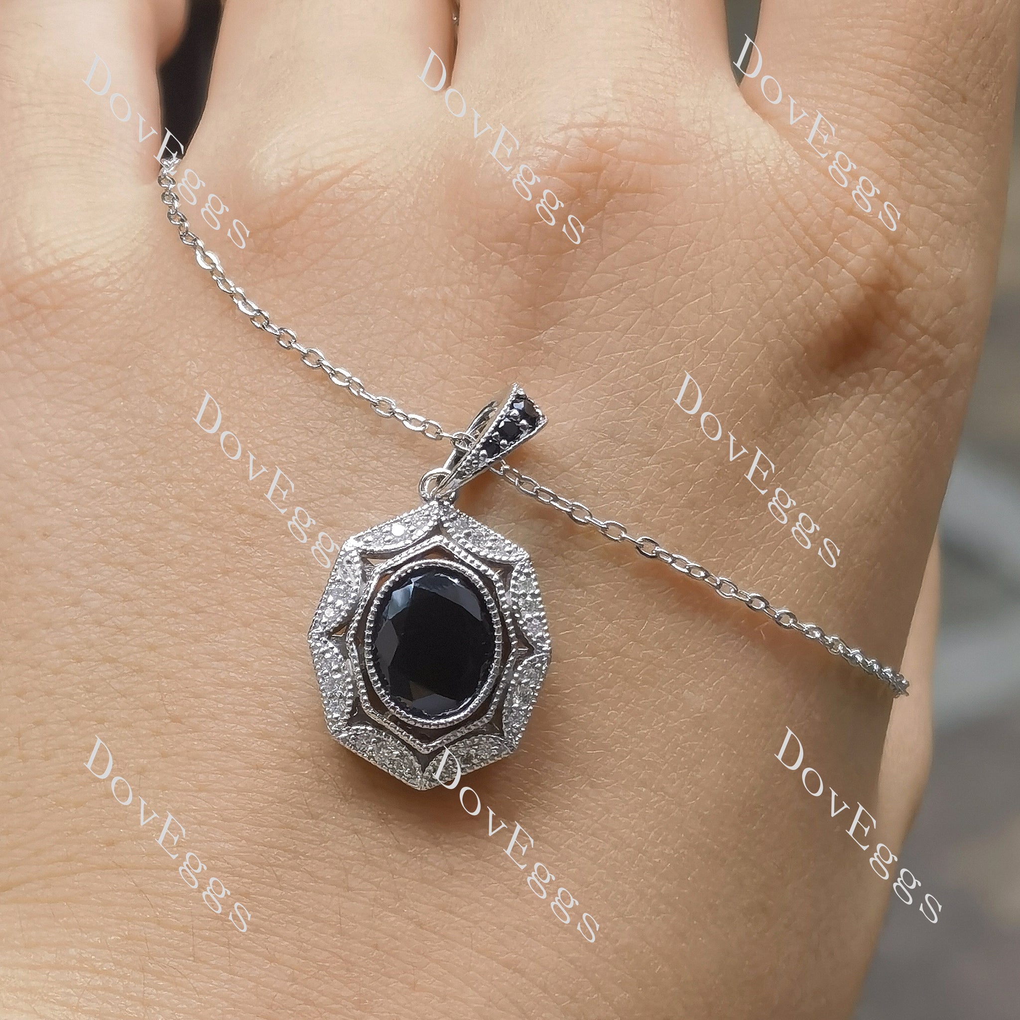 Oval art deco halo black sapphire pendant necklace on hand view| Doveggs