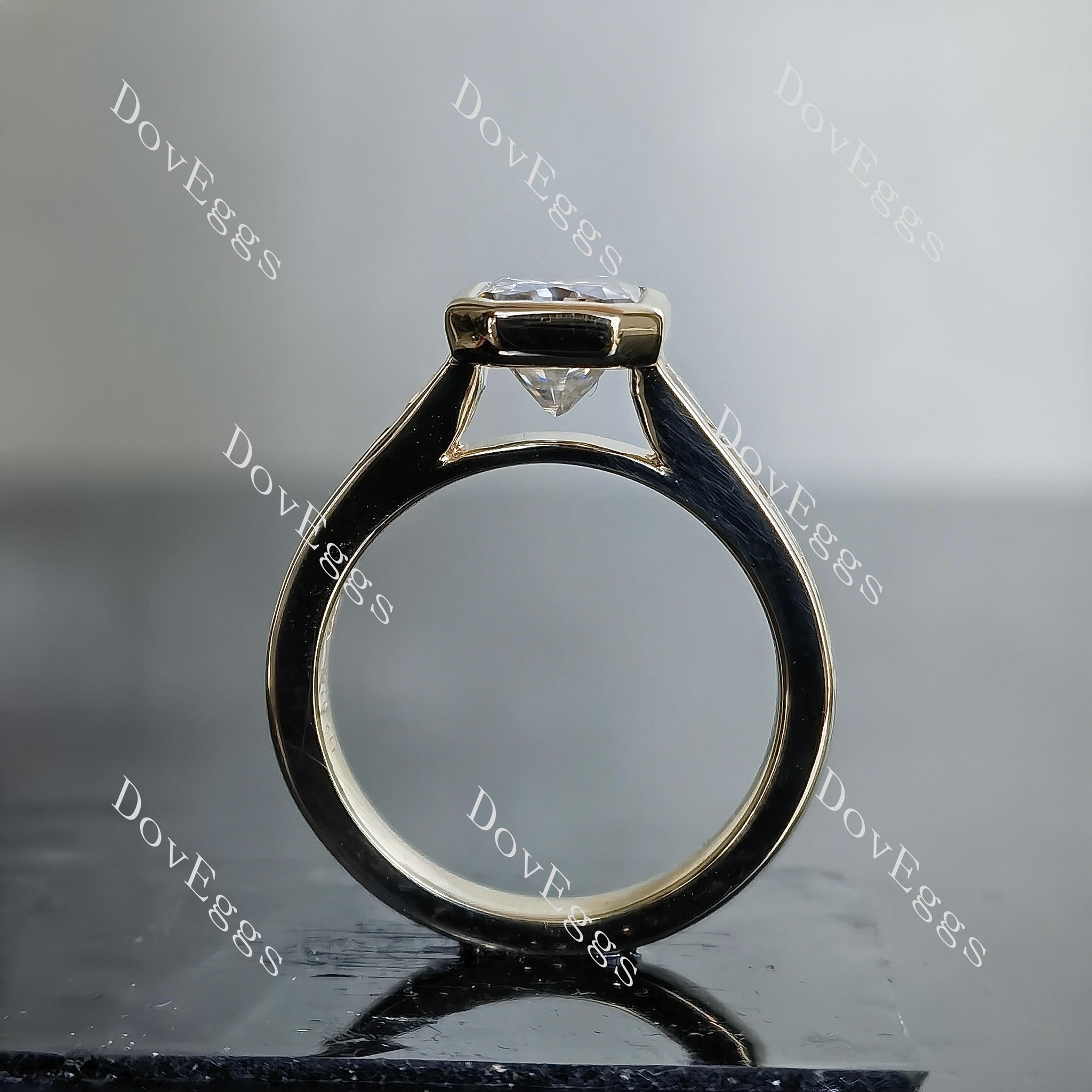 DovEggs oval bezel channel set moissanite engagement ring