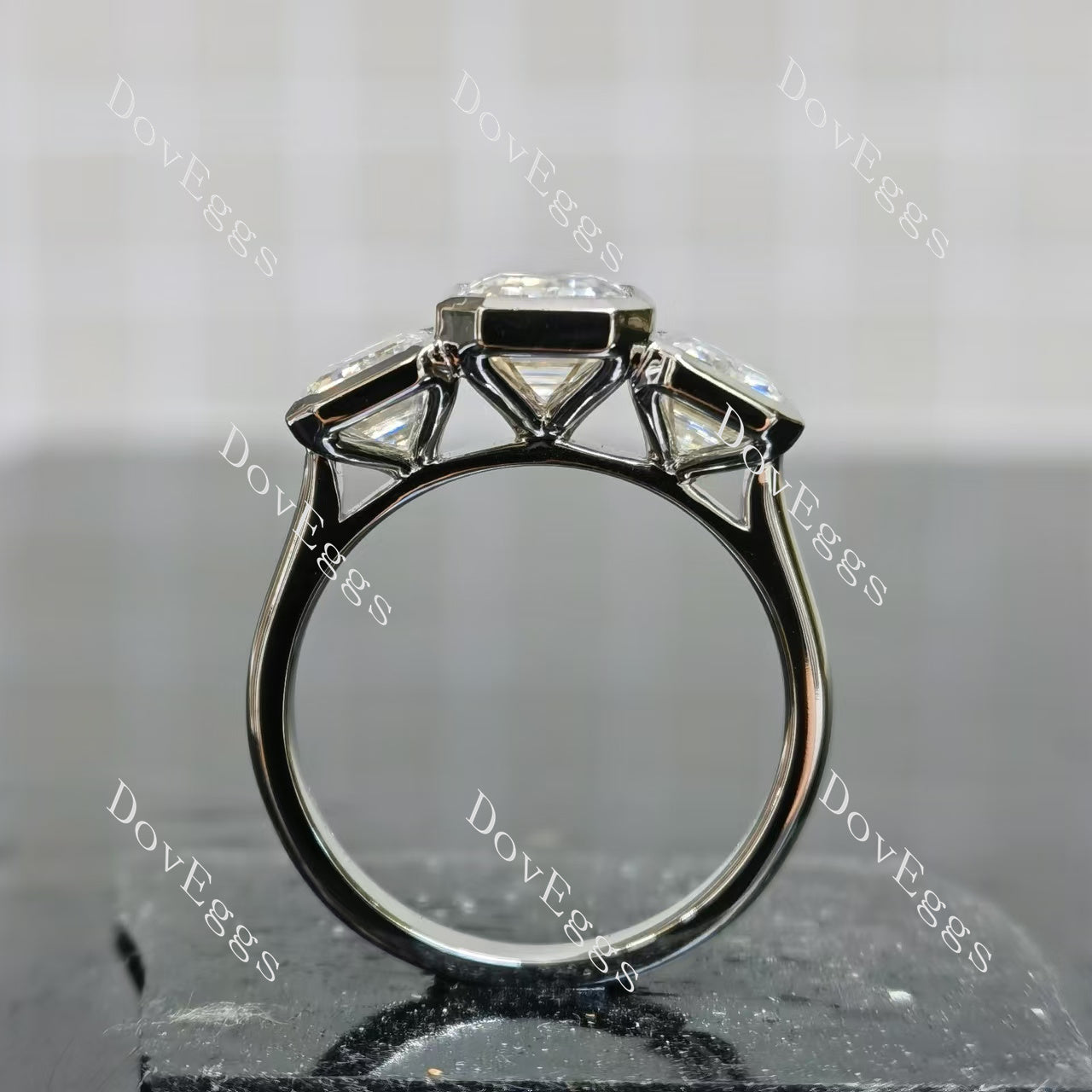 Doveggs emerald/elongated emerald bezel three stones moissanite engagement ring