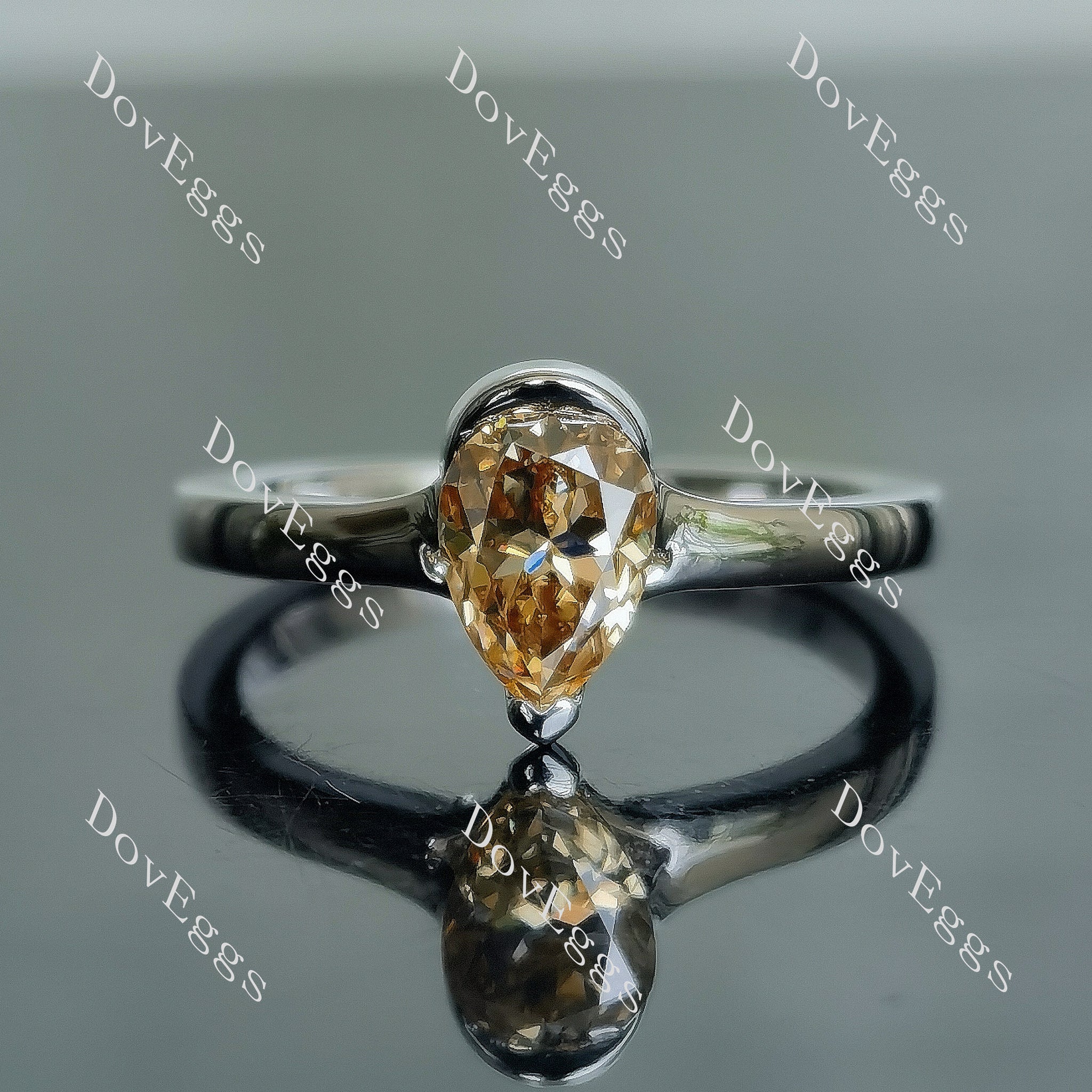 Kindal pear solitaire colored moissanite engagement ring
