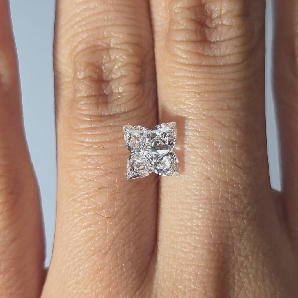 Lab diamond 2.33ct Four Leaf Clover brilliant cut D color VVS1 by DovEggs hand modeled in warm indoor light.