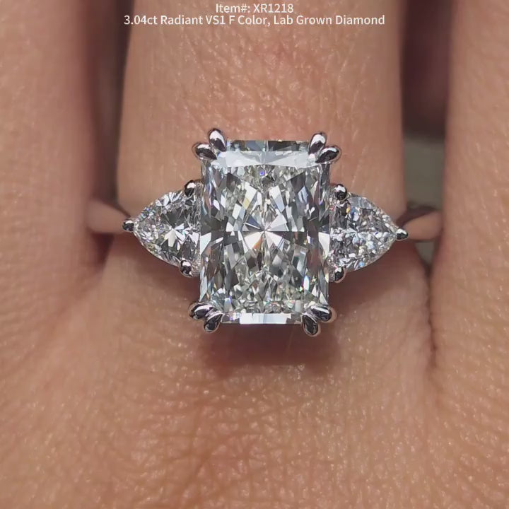 DovEggs radiant three-stone lab diamond engagement ring in sunlight