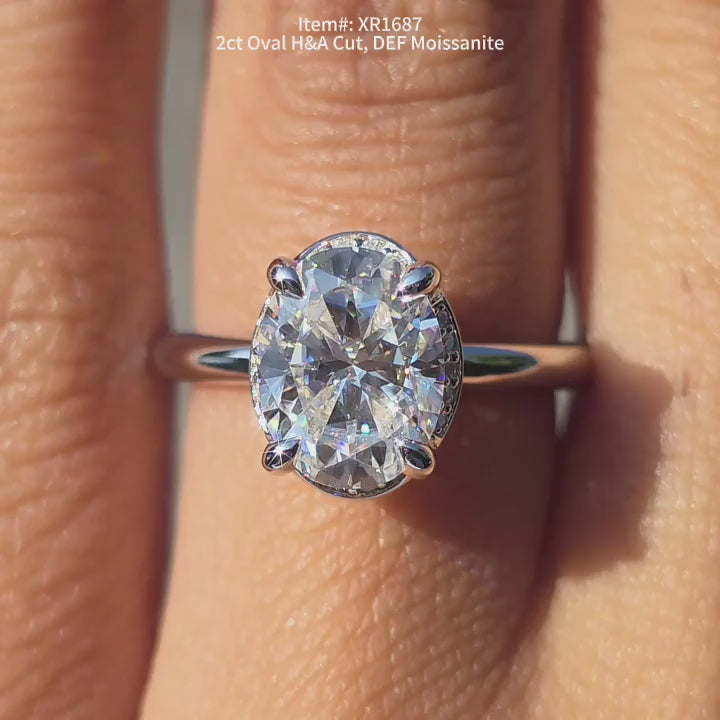 DovEggs H&A cut DEF color oval moissanite ring sparkling in sunlight video