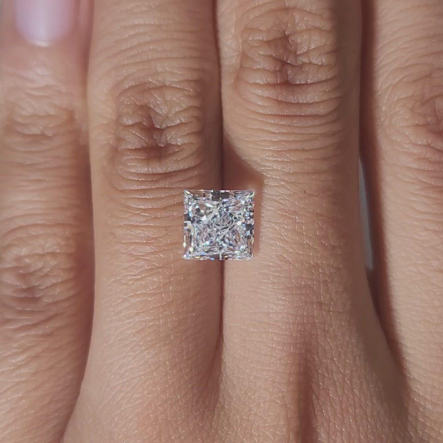 Close-up of princess cut facets in warm lighting lab diamond