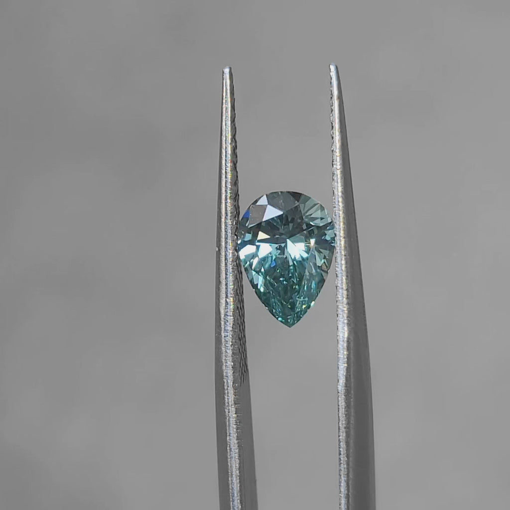 "Sunlight video showing 1.186ct pear cut fancy vivid green diamond's intense color"
