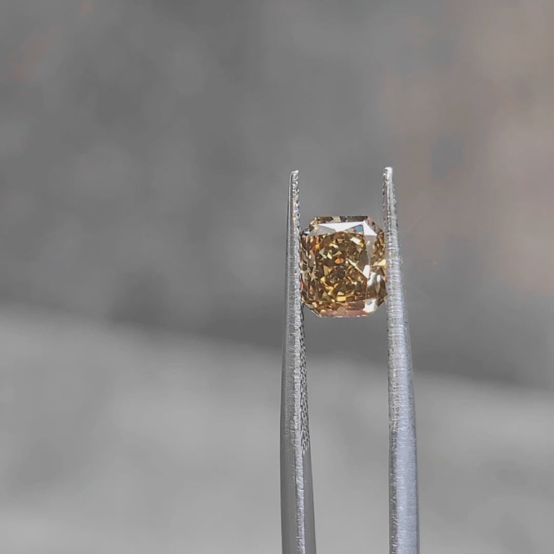 Sunlight video of 1.420ct radiant cut's rich coffee brown color and step faceting