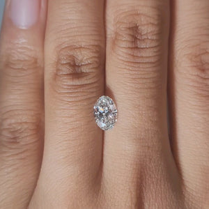 Hand-worn video of 1.03ct oval diamond in warm ambient light