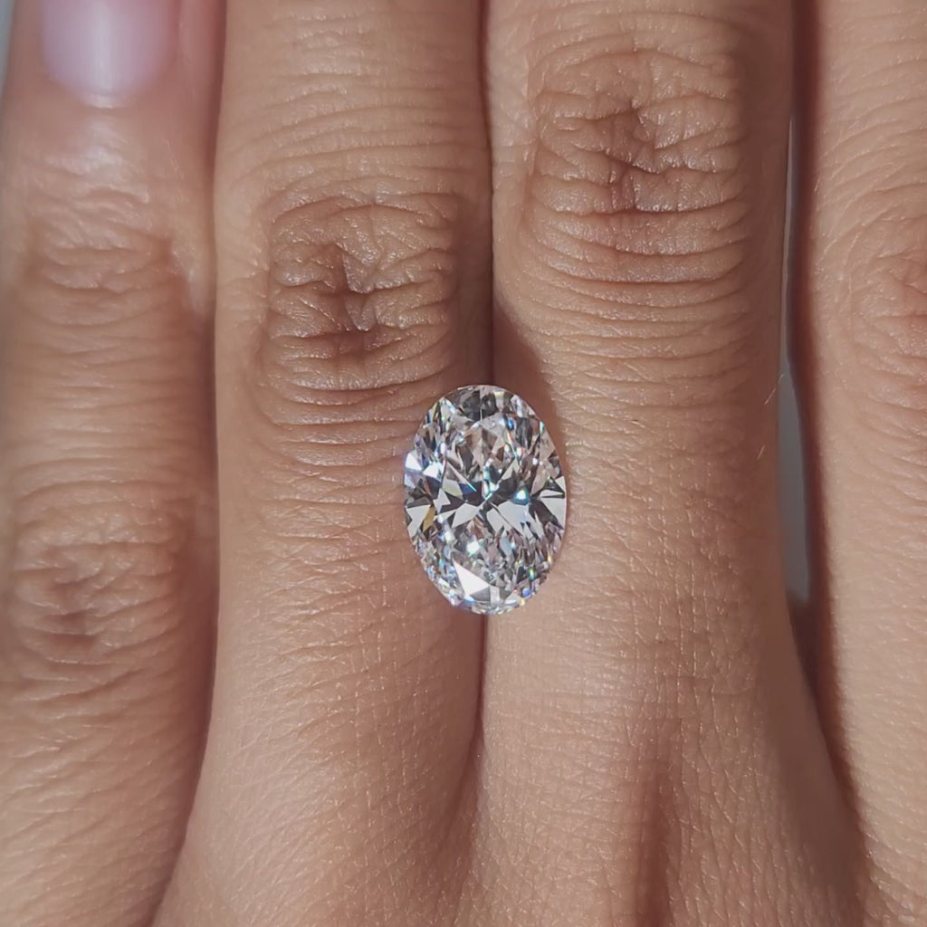 Hand-worn video showing 3.147ct oval diamond in warm home lighting