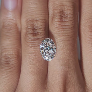 Hand-worn video showing 3.147ct oval diamond in warm home lighting
