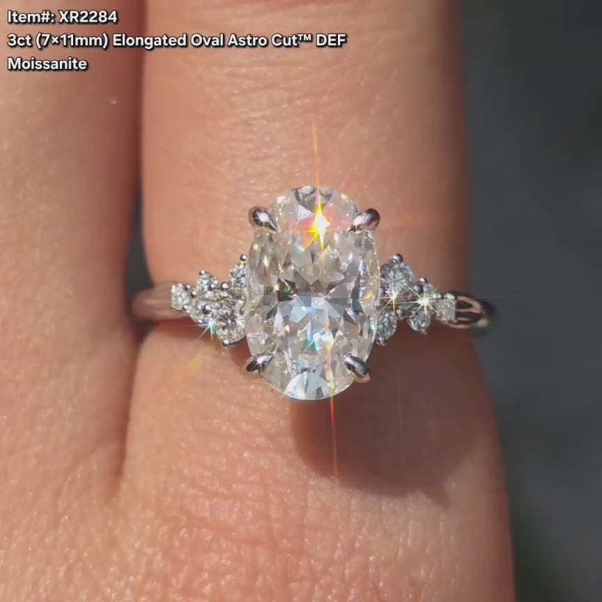 DovEggs elongated oval side stone moissanite engagement ring video in sunlight