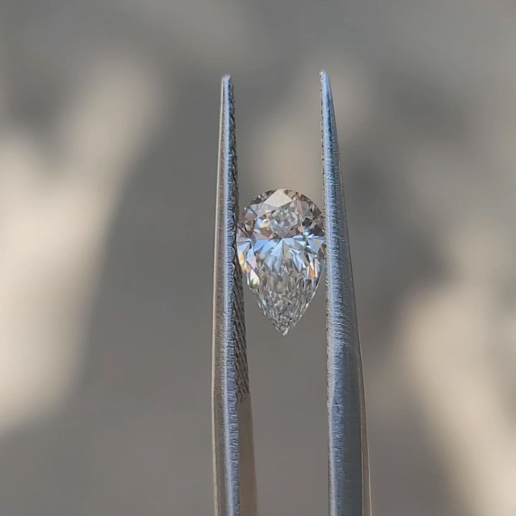 "Sunlight video showing 1.00ct pear cut diamond's elegant shape"