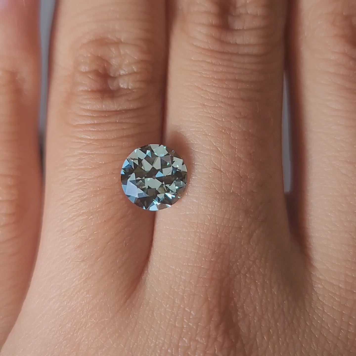 "Video showcasing 2.08ct green old euro lab diamond on velvet background"