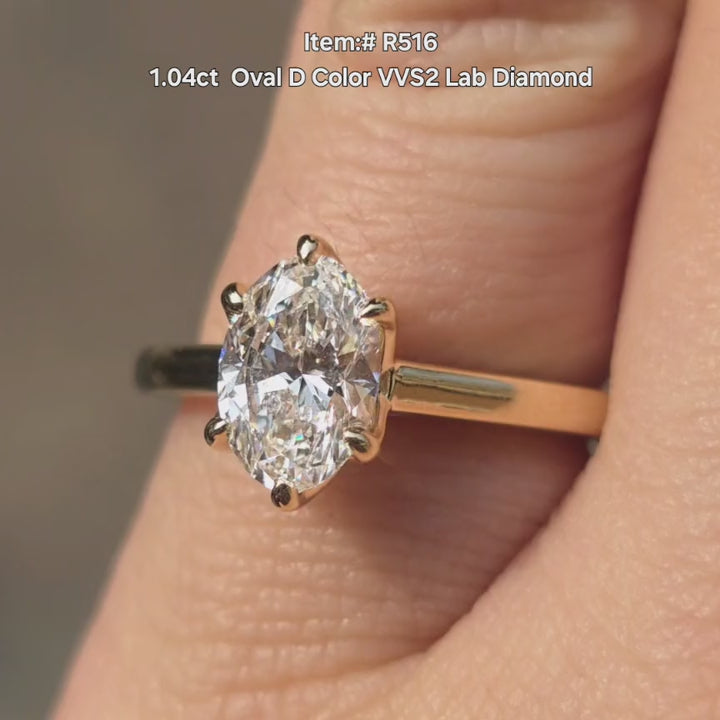 DovEggs  solitaire Oval lab diamond engagement  ring sparkling in sunlight video.