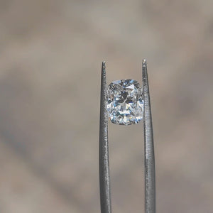 Daylight video showcasing 2.12ct cushion cut's D color puri