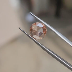 "Sunlit video of 2.45ct rose cut's pink saturation and unique light dispersion"