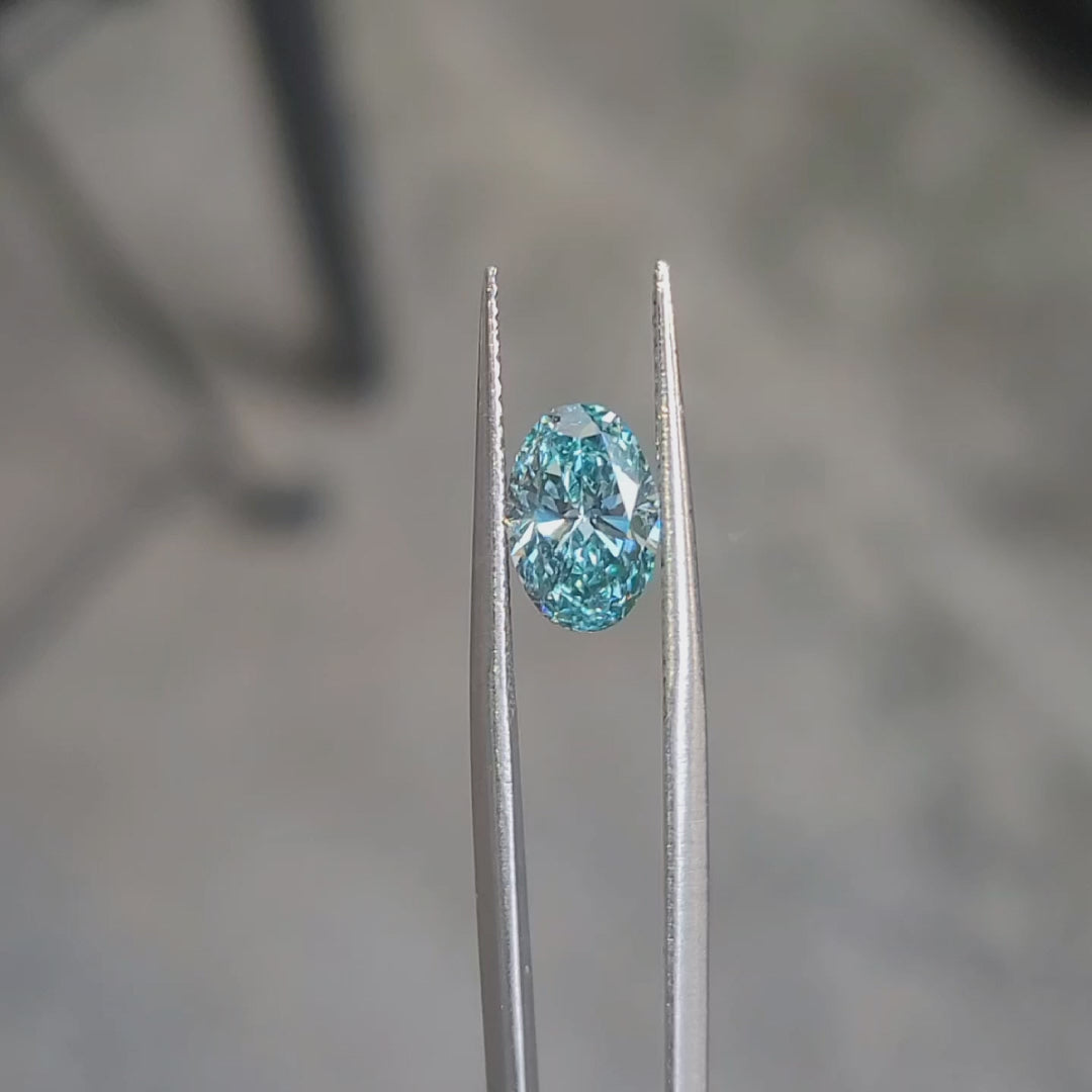 1.608ct oval cut vivid blue diamond's color intensity in sunlight