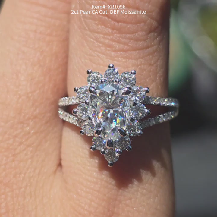  DovEggs  DEF color CA cut pear moissanite ring sparkling in sunlight video