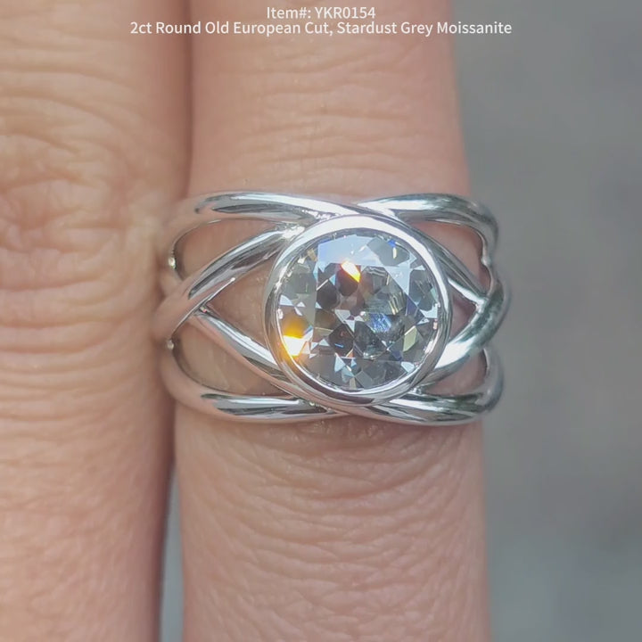 round old european cut stardust grey moissanite ring sparkling in sunlight video