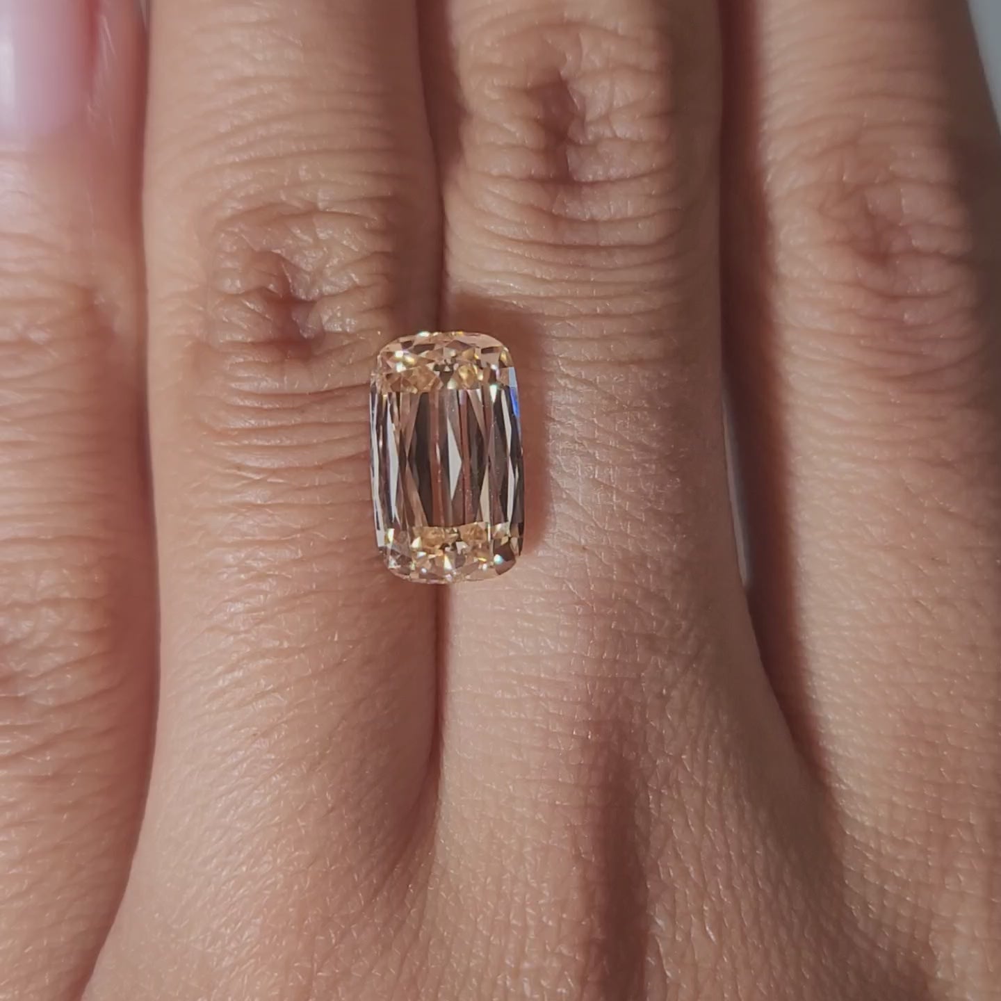 Close-up video of 4.55ct orange cushion diamond facets