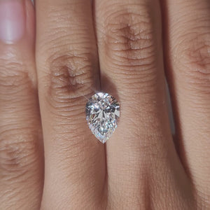 Hand-worn video of 2.645ct pear diamond in warm interior lighting