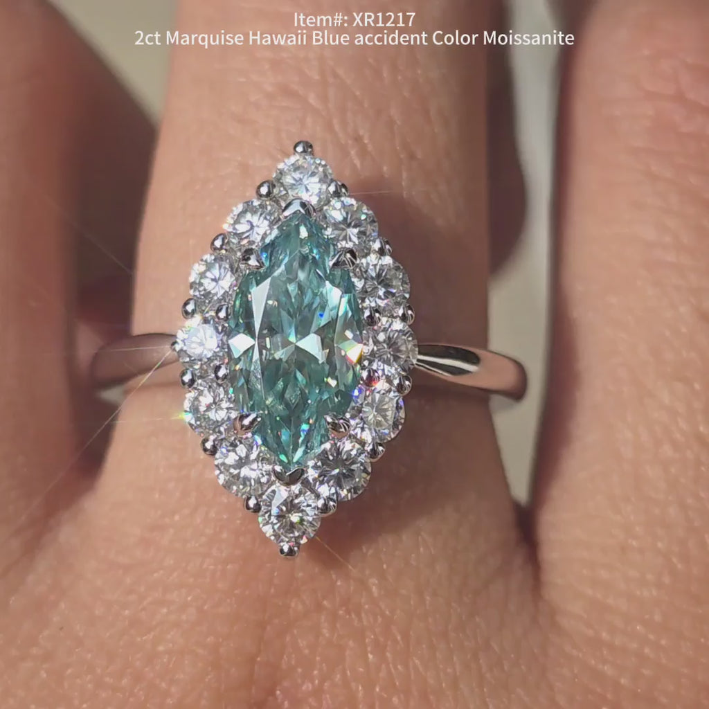 Doveggs marquise blue moissanite ring sparkling in sunlight video.