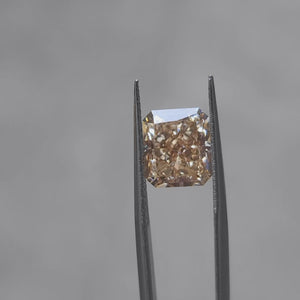 5.16ct radiant cut fancy vivid orange lab diamond sparkling in sunlight, showcasing intense color saturation