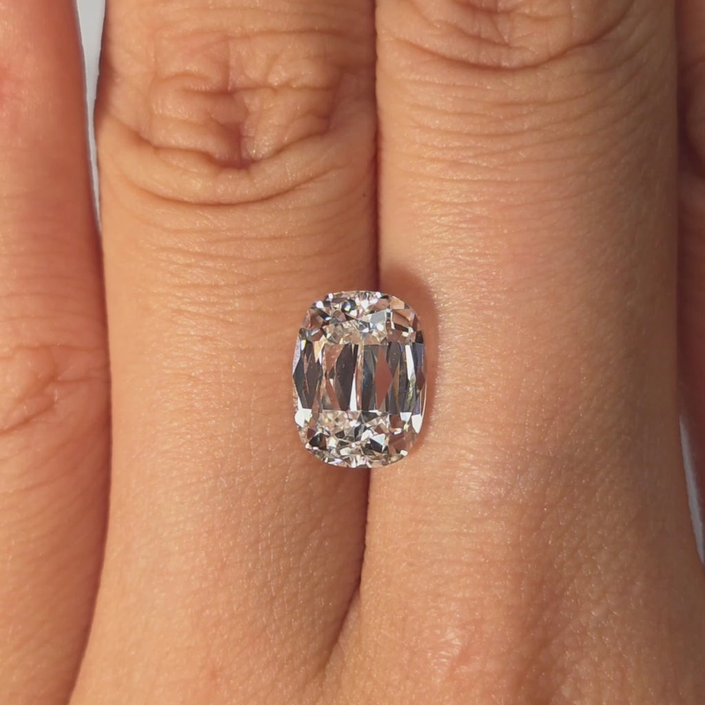 Lab diamond 3.15ct cushion brilliant cut D color VS1 by DovEggs hand modeled in warm indoor light.