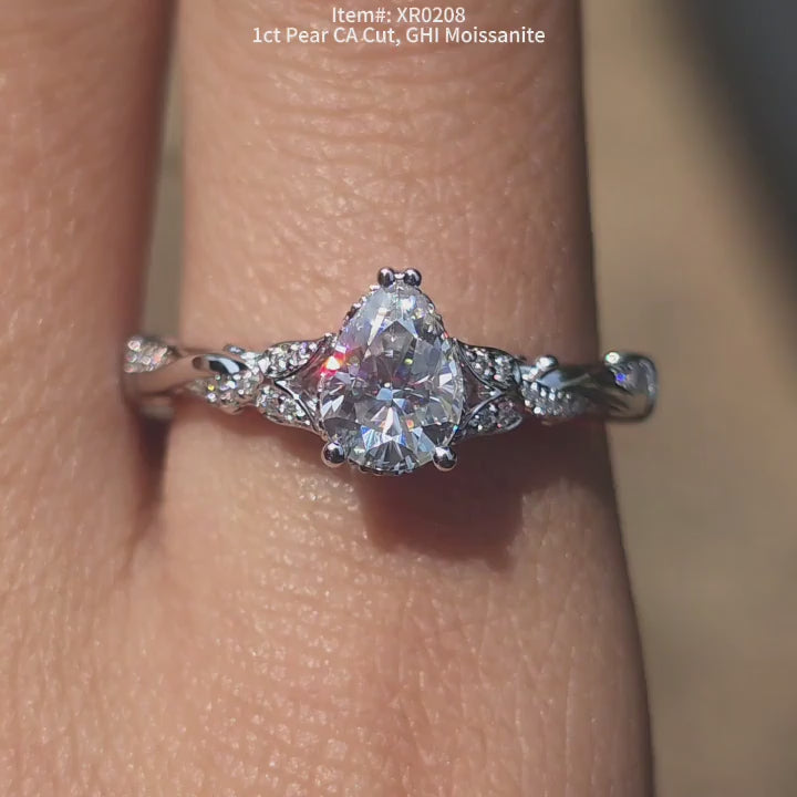 DovEggs GHI color CA cut pear moissanite ring sparkling in sunlight video