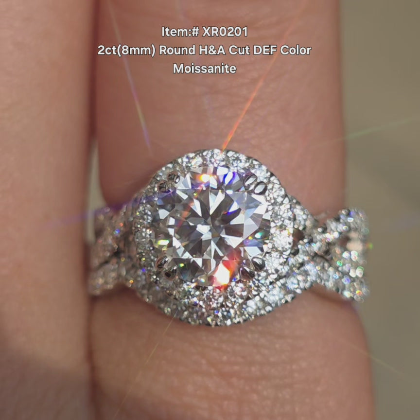 DovEggs round H&A cut DEF color moissanite ring sparkling in sunlight video.