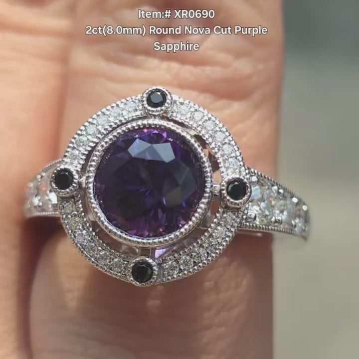 DovEggs 2ct Round Nova cut Purple sapphire engagement ring in bezel setting with milgrain video.
