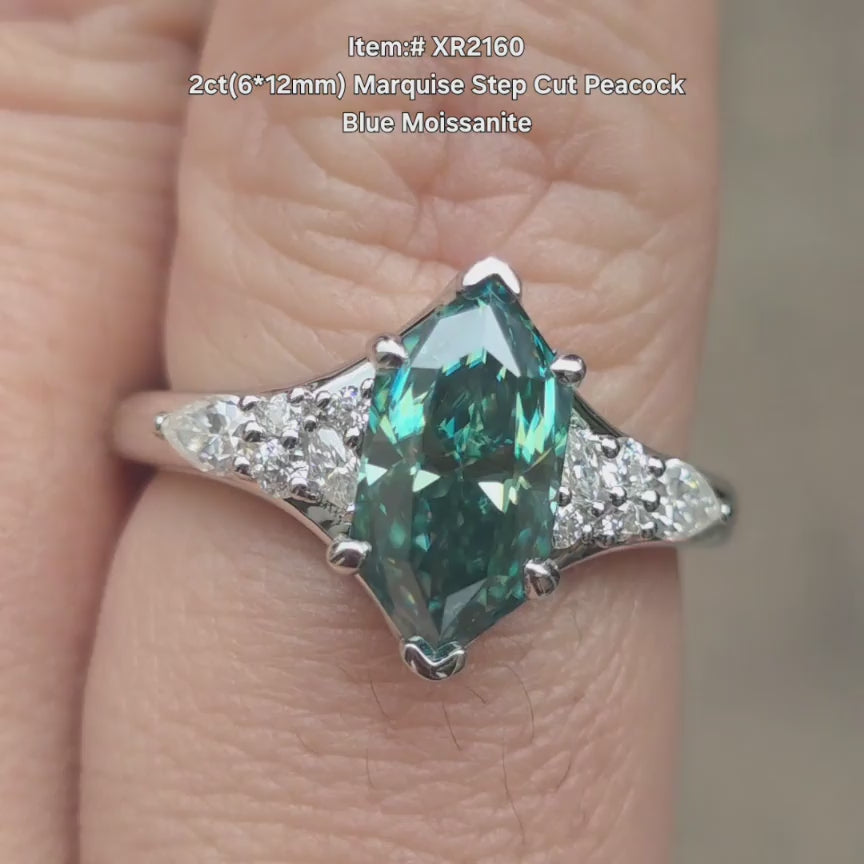 DovEggs Peacock blue marquise step moissanite ring sparkling in sunlight video