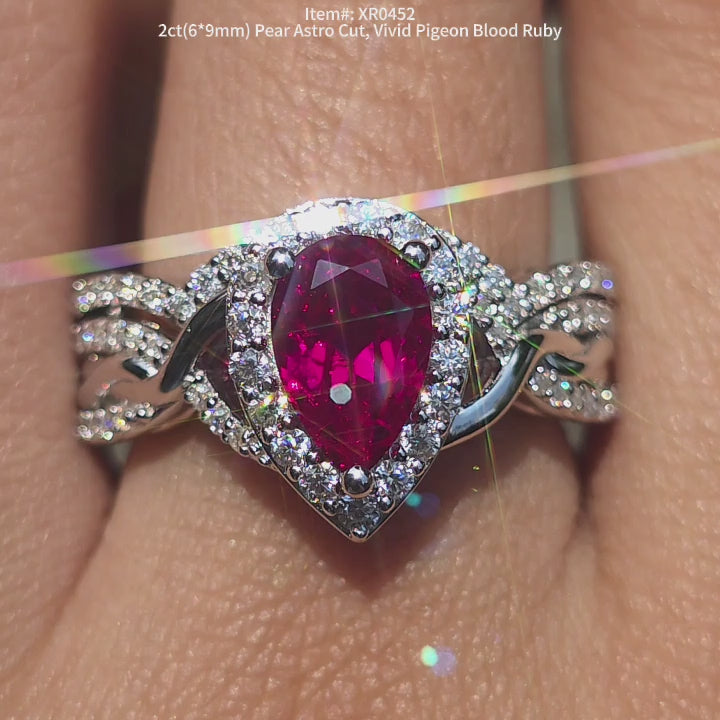 DovEggs Pear Astro cut vivid ruby engagement ring matching with a curved band ring set on-hnad video.