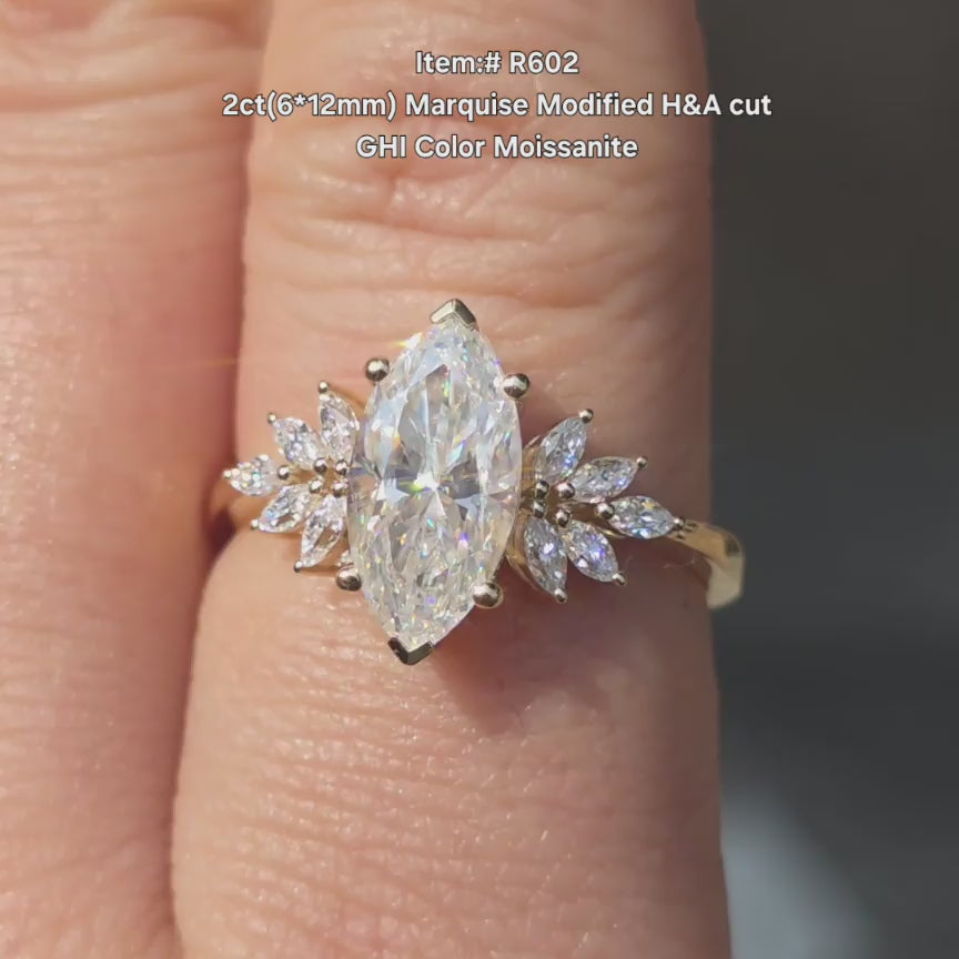 DovEggs H&A Modified Marquise GHI color moissanite ring sparkling in sunlight video