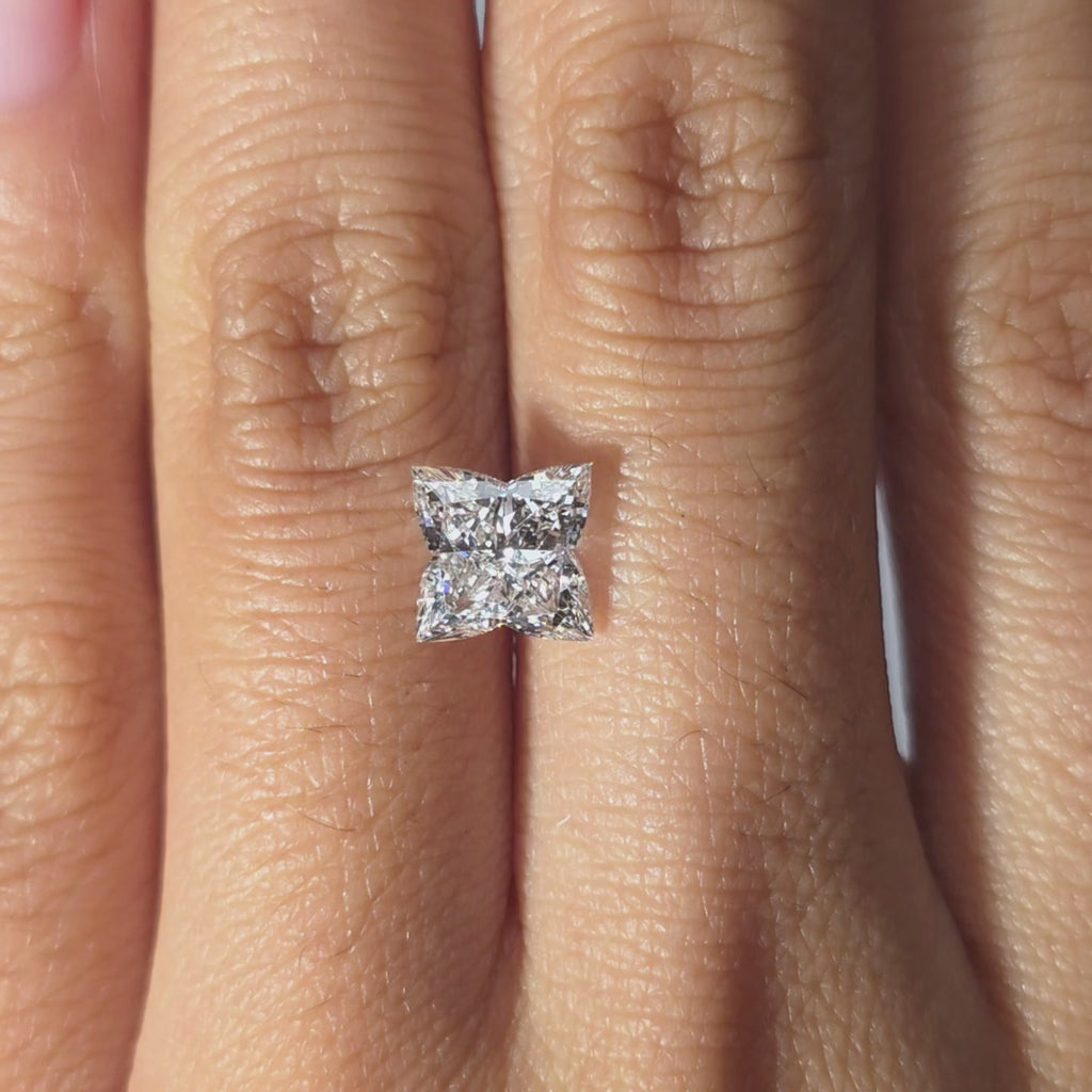 Lab diamond 2.20ct Four Leaf Clover brilliant cut D color VVS1 by DovEggs hand modeled in warm indoor light.