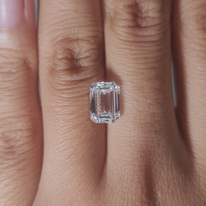 Close-up video of 2.54ct D color emerald cut diamond's clarity under warm light