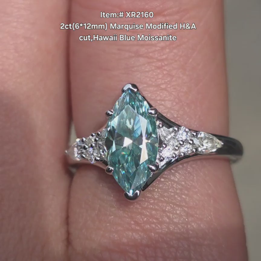 DovEggs Modified Marquise H&A Hawaii Blue moissanite ring sparkling in sunlight video