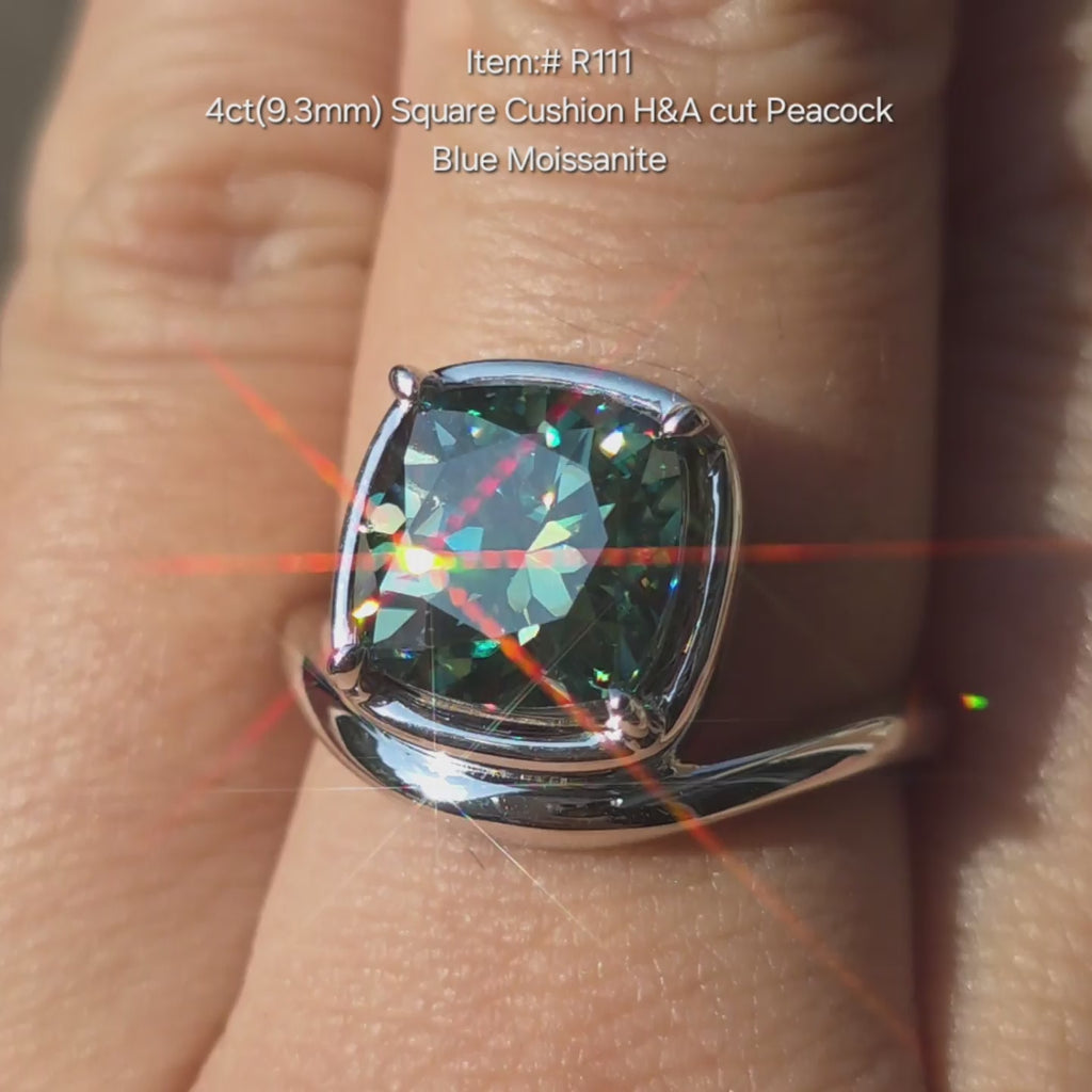 Square cushion Peacick blue moissanite ring sparkling in sunlight video.