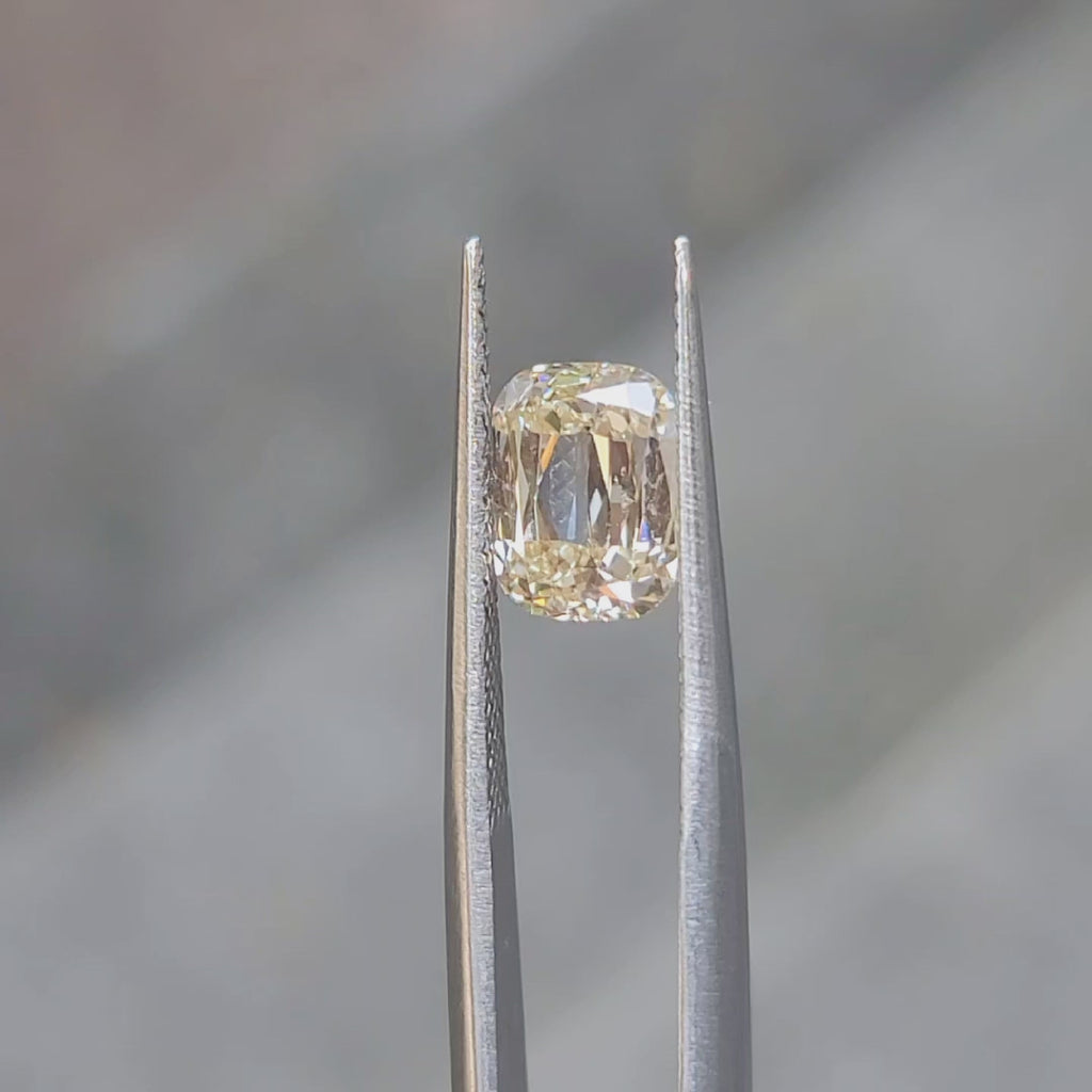 Outdoor video showcasing 2.092ct cushion diamond's fancy yellow hue