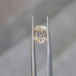 Outdoor video showcasing 2.092ct cushion diamond's fancy yellow hue