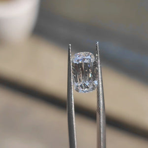 3.12ct modified cushion lab diamond (D/VVS1) outdoors, displaying unique facet pattern and brilliance