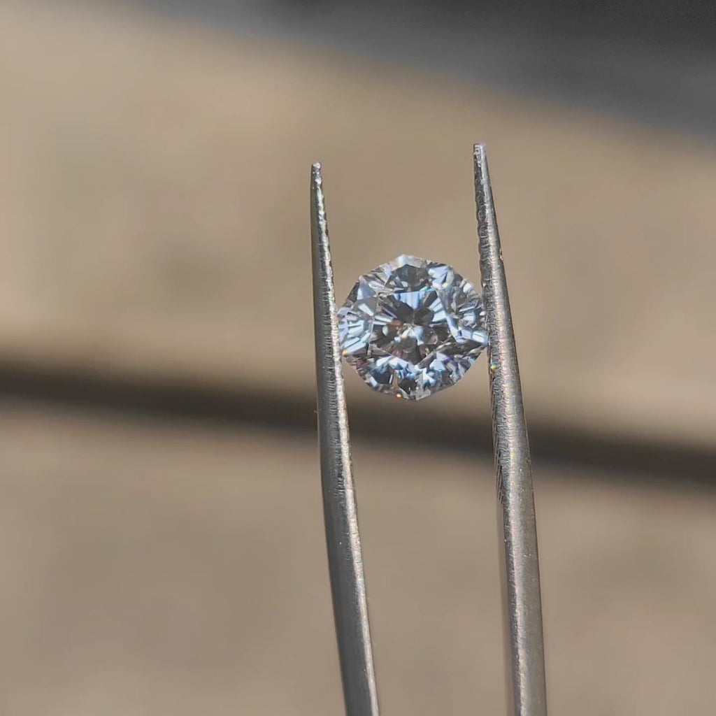 Close-up video of Doveggs’ 2.09ct emerald cut lab diamond with F color, VVS1 clarity, and excellent cut, showcasing brilliance and facets.