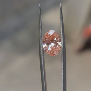 3.17ct Oval pink diamond’s vivid sparkle enhanced by outdoor light