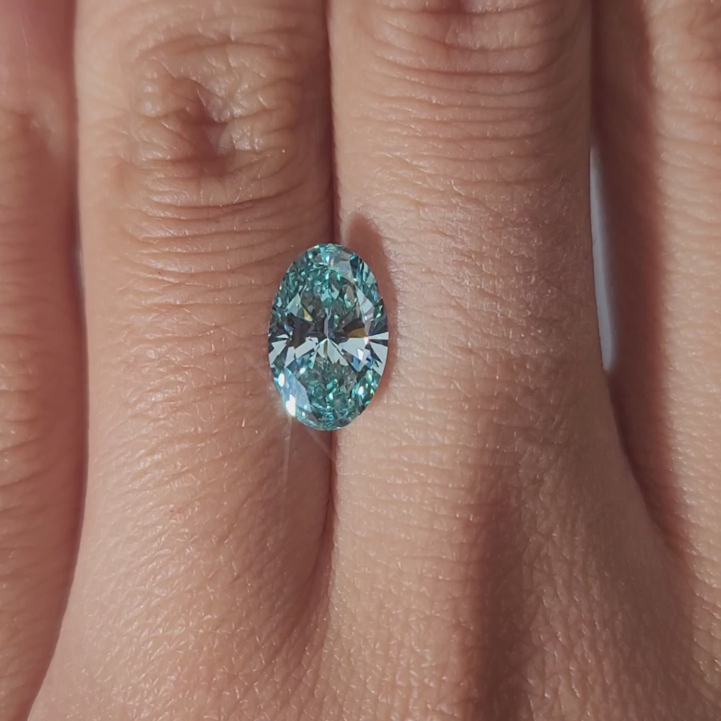 Close-up video of 2.002ct blue diamond rotating in diffused light